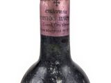 a bottle of wine that is sitting on a table