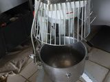 an image of a kitchen with a mixer on the floor