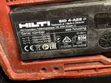 a close up of the back of a red and black machine
