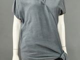 an image of a mannequin wearing a grey top and black skirt