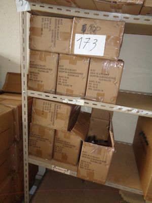 boxes are stacked on a shelf in a room with boxes on it