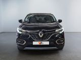 the front view of a black car in a white room