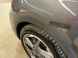 a close up of a car ' s tire with a sticker on it