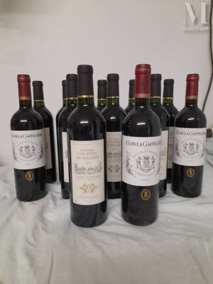 several bottles of wine are lined up on a table