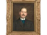 portrait d'un homme en costume-cravate dans un cadre doré