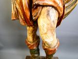 a statue of a man holding a bird in his hand