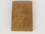 an image of a gold plate with a dragon on it