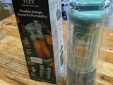 a box of nutribullet next to a blender on a table