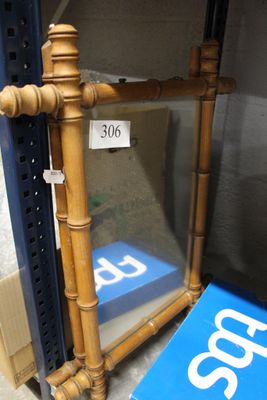 a blue sign on the shelf next to a mirror