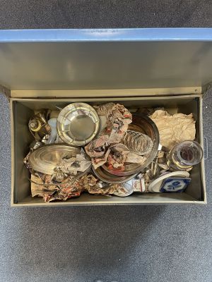 a box full of assorted items sitting on the floor