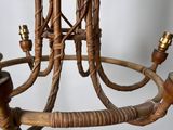 a chandelier made out of wicker and wood