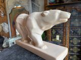a statue of a bear that is on top of a table
