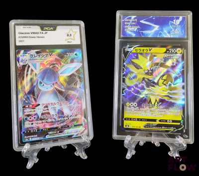 two pokemon cards in clear plastic cases on a black background