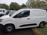 a white van that is parked in a parking lot