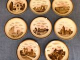 six plates with a picture of a castle on them on a blue cloth