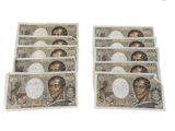 quatre billets de cent dollars à l'effigie du président Obama