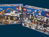 two boxes of lego city sets on a blue background