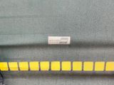a suitcase that has yellow stickers on the side of it