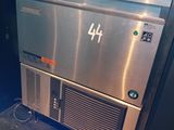 a stainless steel oven sitting in the middle of a kitchen