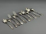 a set of six silverplated forks and spoons