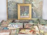 a lot of paintings and paintings on the table