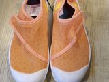 a pair of shoes that are on a wooden floor