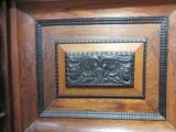 a close up of a wooden door with a decorative design