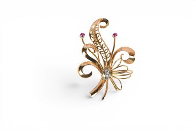 an image of a gold ring with pink stones on a white background