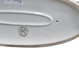 a close up of a plate with a handle on it