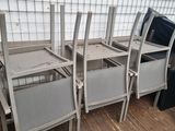 a lot of chairs that are sitting on a wooden floor