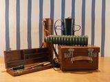 a suitcase and a pair of boots sitting on a table