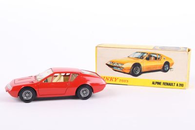 a toy car that is sitting next to a box