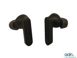 two black ear buds sitting next to each other on top of a white surface
