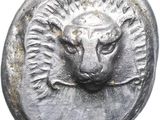 an image of a silver coin with a lion ' s head on it