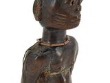 a figurine of a man with a hat on his head