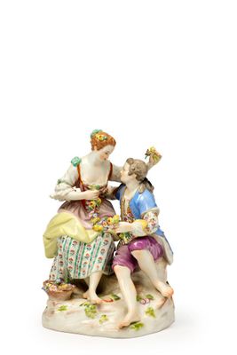 une image représentant une figurine de deux femmes assises sur un banc