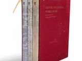 an image of a red book with three books on top of it
