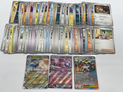 a lot of different pokemon cards on the table
