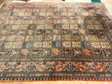 rug on the floor in a room with a chair and a table