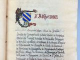 an open book with a picture of a dragon and a coat of arms