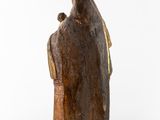 an image of a statue of a man with a bird on his shoulder