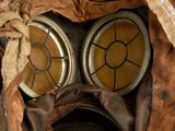 an old gas mask with a gas mask on it ' s face