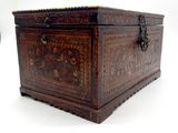 a small wooden box with a decorative design on it