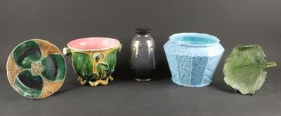 four different vases sitting next to each other on a table
