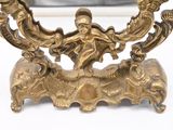a gold plate with a picture of a man and a woman on it