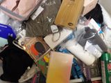 a pile of items sitting on top of a bed