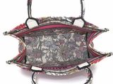 the inside of a handbag with a floral pattern on it