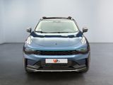 the front view of a blue electric car in a white room
