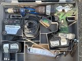 a tool kit in a plastic case on the ground
