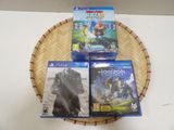 three video games sitting on top of a basket on a table